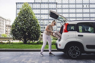 Smiling Woman on Laptop